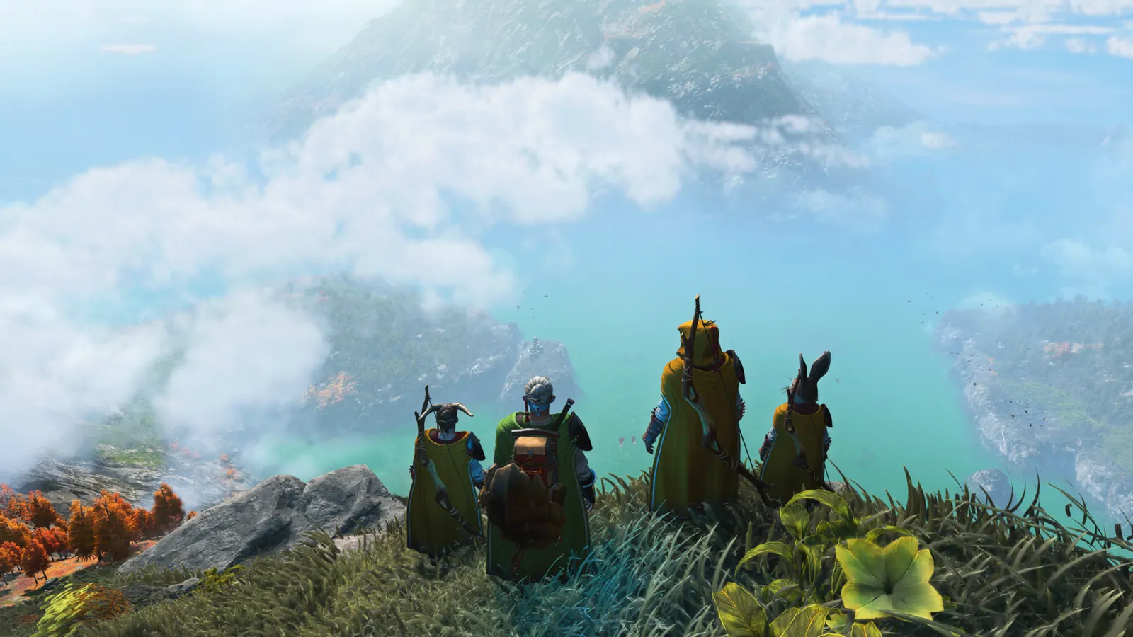 A group of travellers looks from a grassy ridge over misty mountains and water. Official Hello Games screenshot.